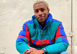 young trendy man in a colorful jacket