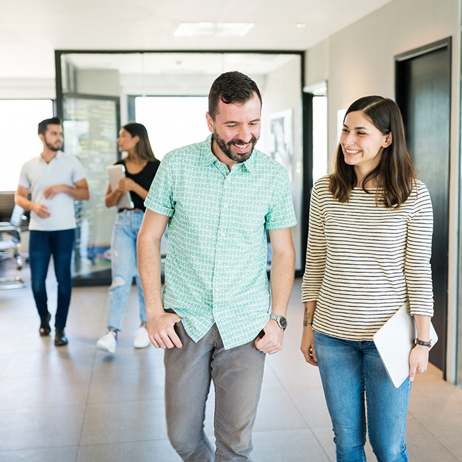 Employees walking to a meeting room