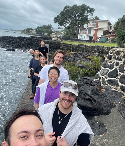 A row of employees on the beach