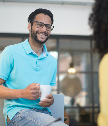 An employee drinking coffee