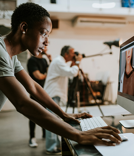 A person working over a desktop designing