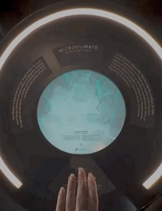 A hand motioning over a blue ball