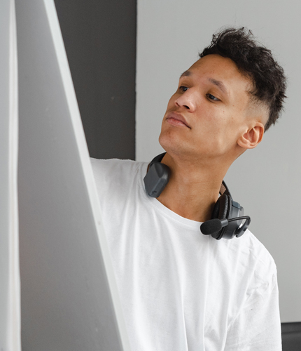 An employee works at a whiteboard