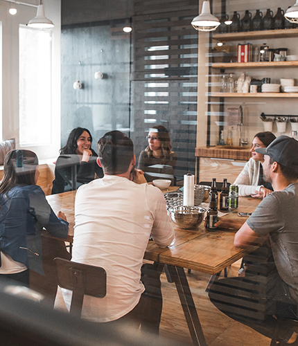 Employees gather in a meeting room