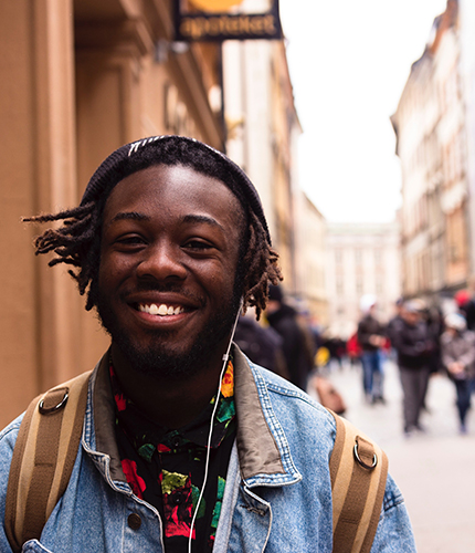 An employee smiling walking to work