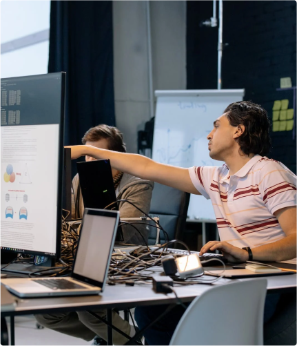 Employees talking to each other at their desks