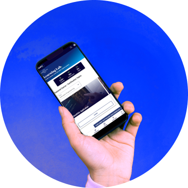 A hand holding a phone with the Built In application on it