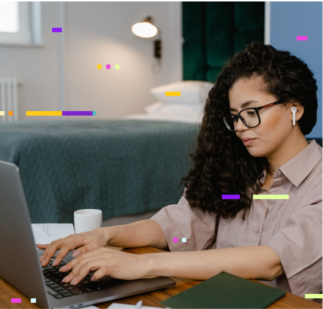 A person sitting on a couch working on a laptop