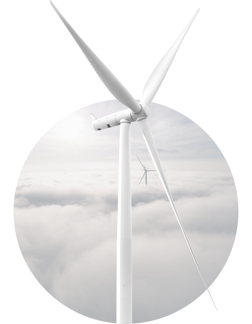 A white windmill in front of a cloudscape