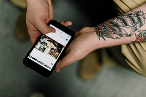 A person holding a cellphone on social media