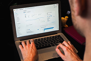 A person using google analytics on a laptop
