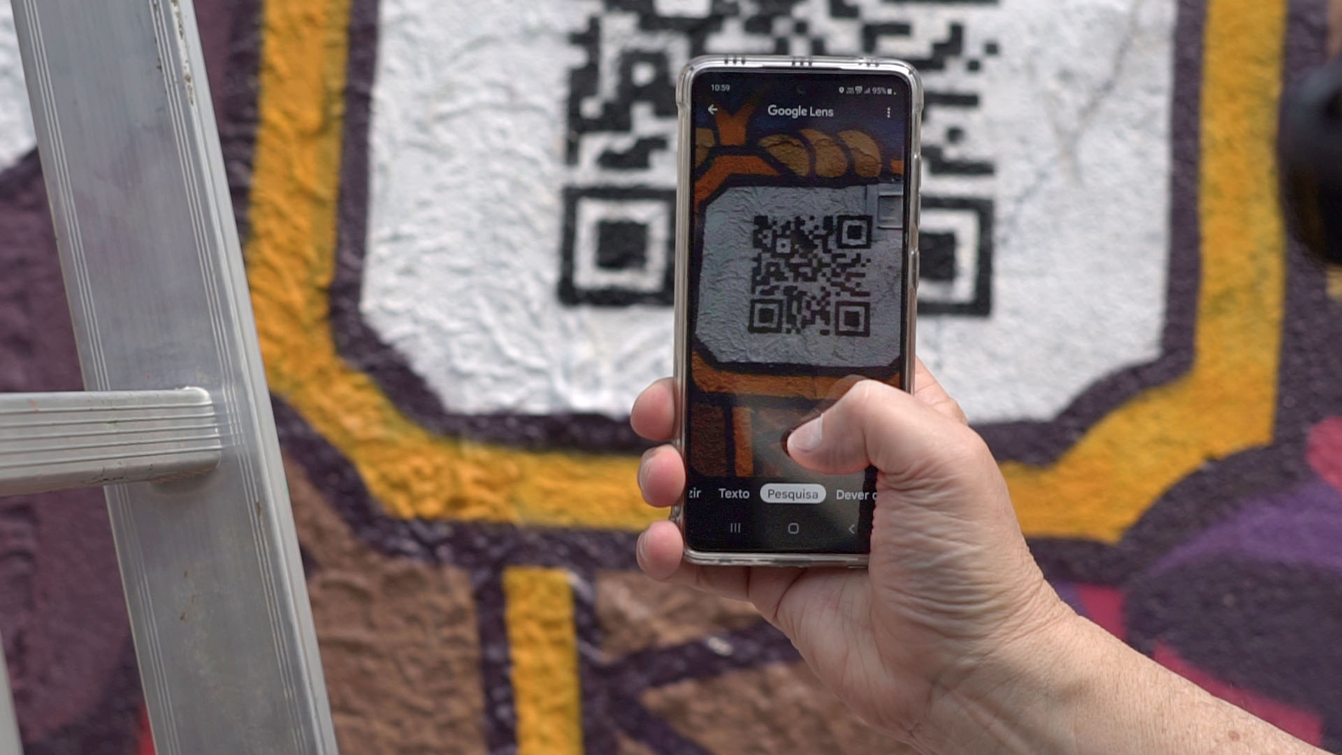 A phone taking a picture of a QR code