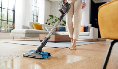 A Phillips vacuum being used on a living room floor