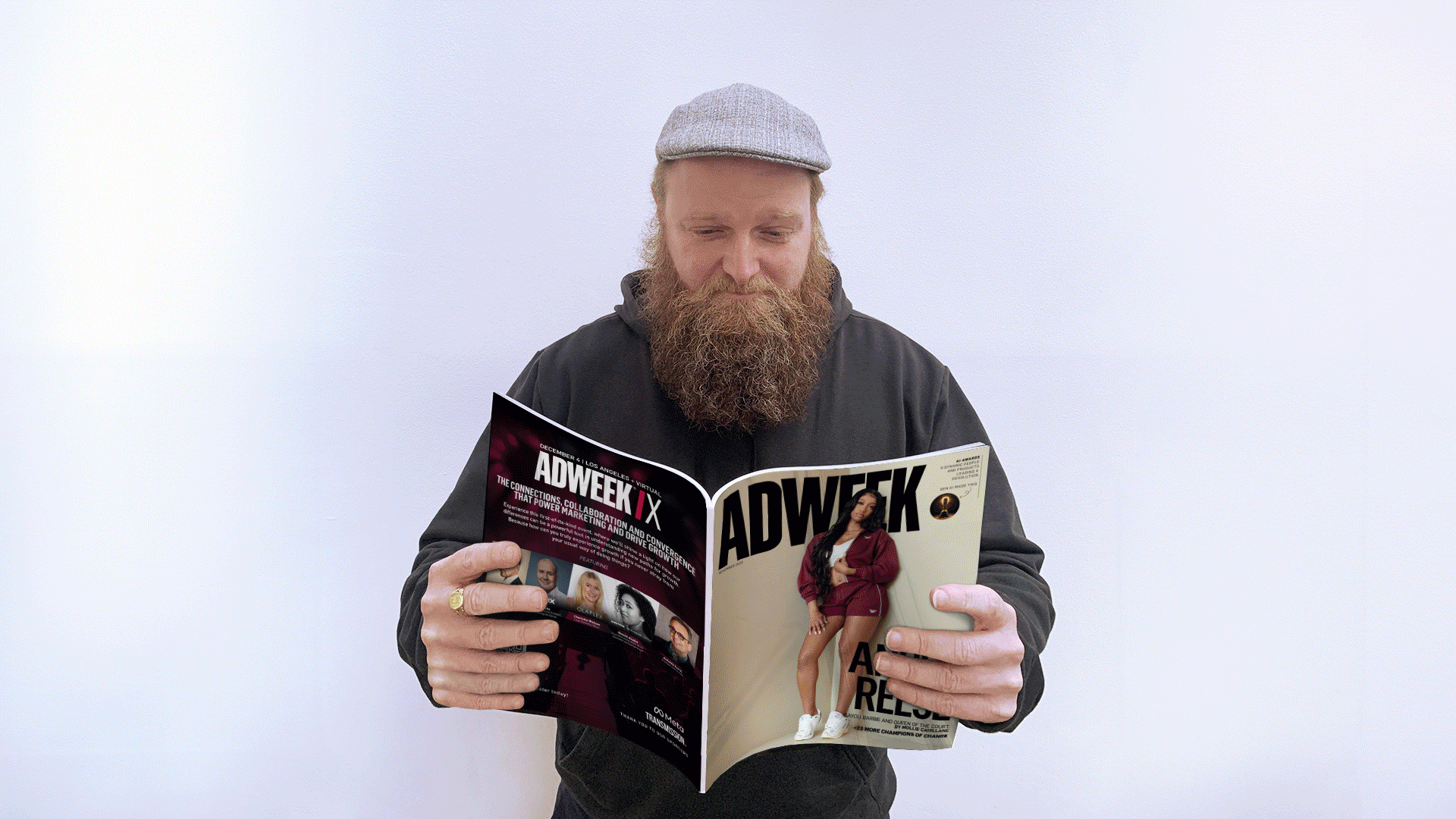 man with a beard and newsboy cap holding a magazine with a cover about the topic of artificial intelligence