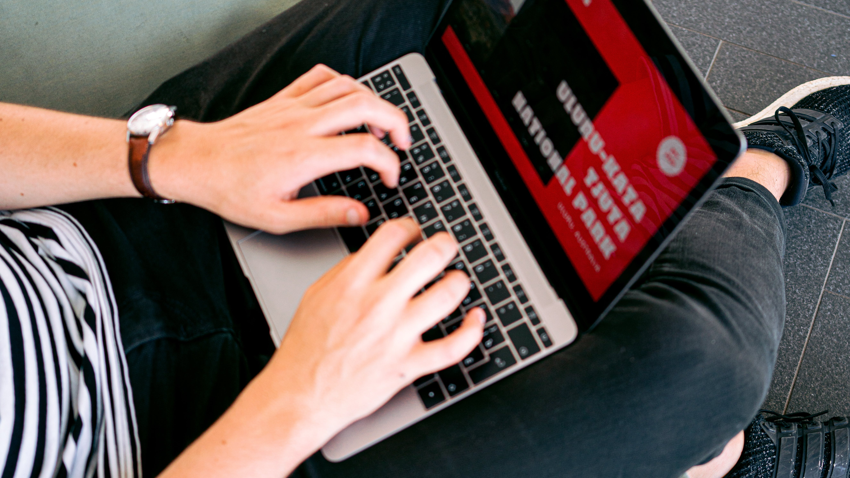 Person browsing the web on a laptop