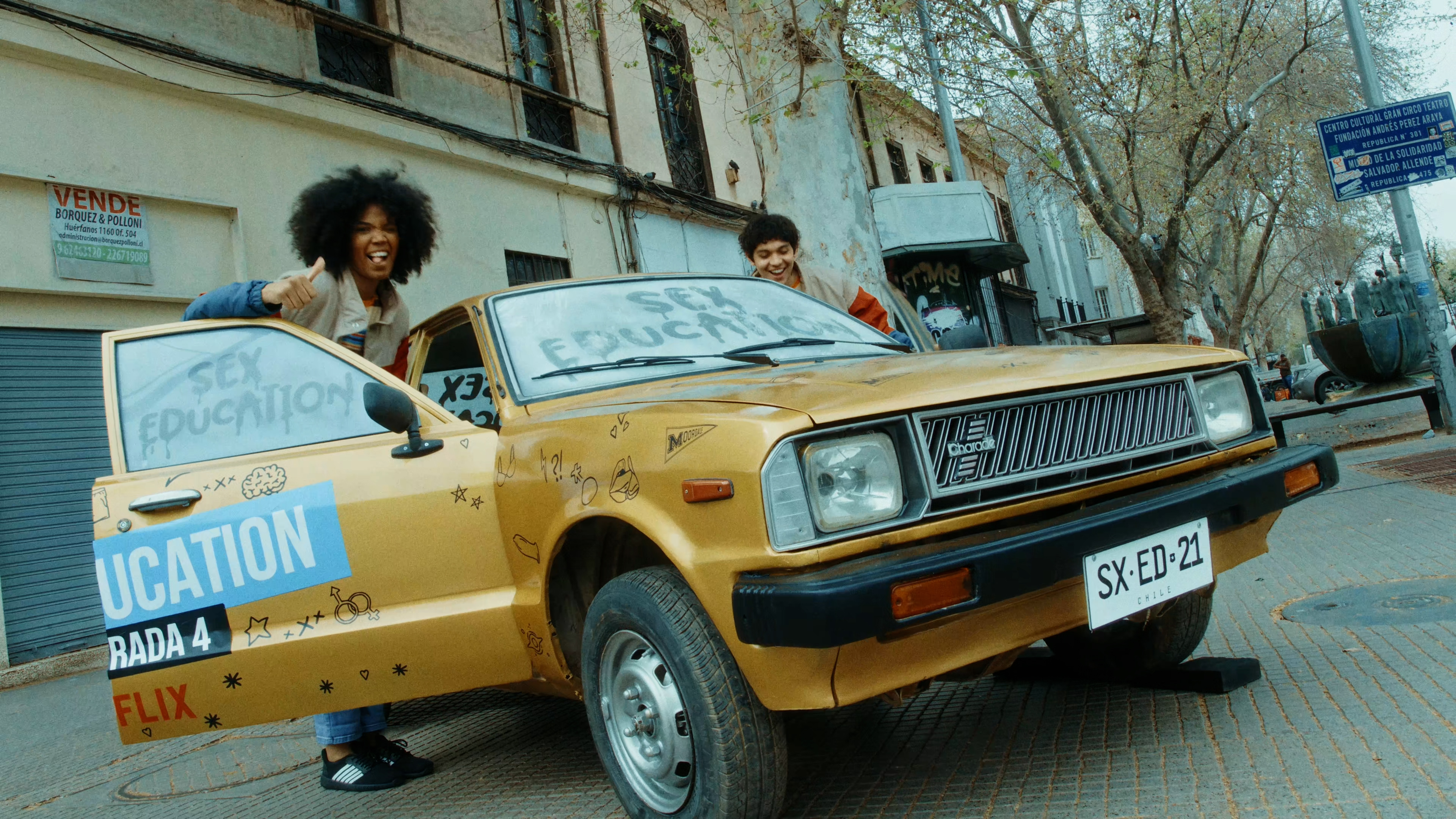 Person is stepping into the yellow sex education car