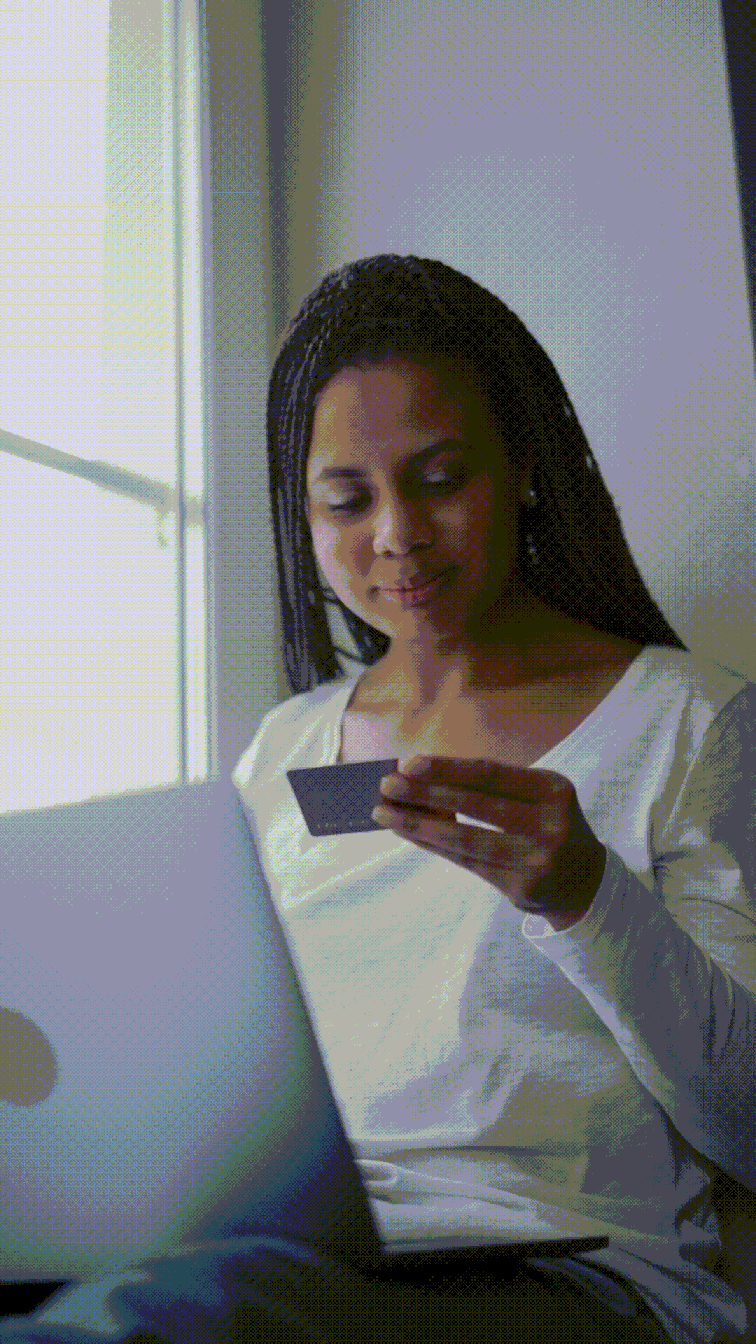 woman on a computer with a credit card