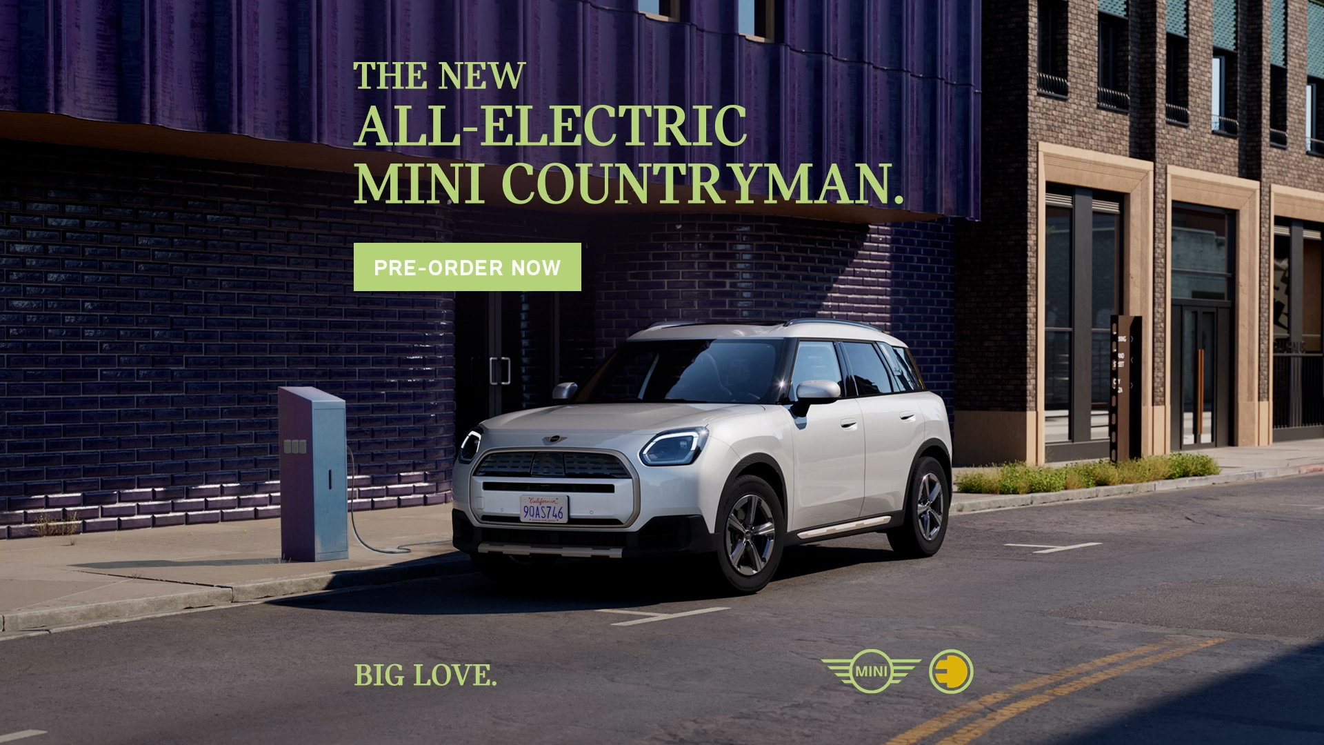 bmw mini ad showing a countryman vehicle in front of an blue wall