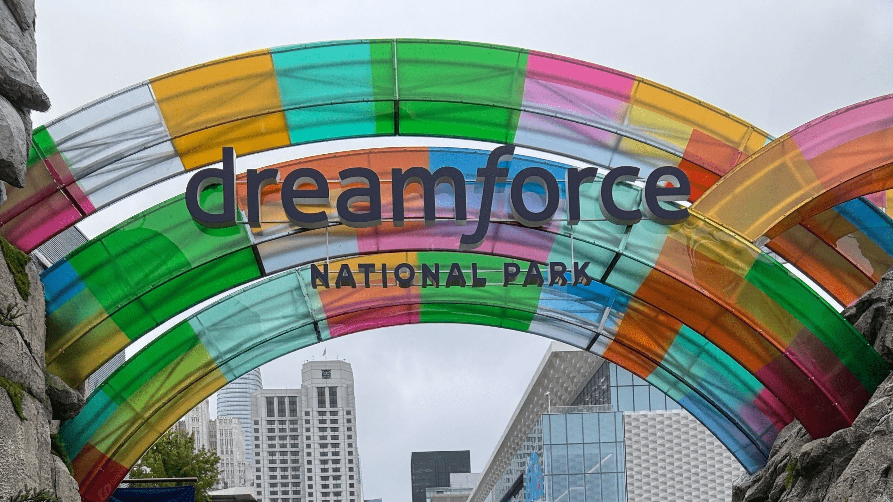 Colorful arch with the words "Dreamforce National Park" in an urban setting.