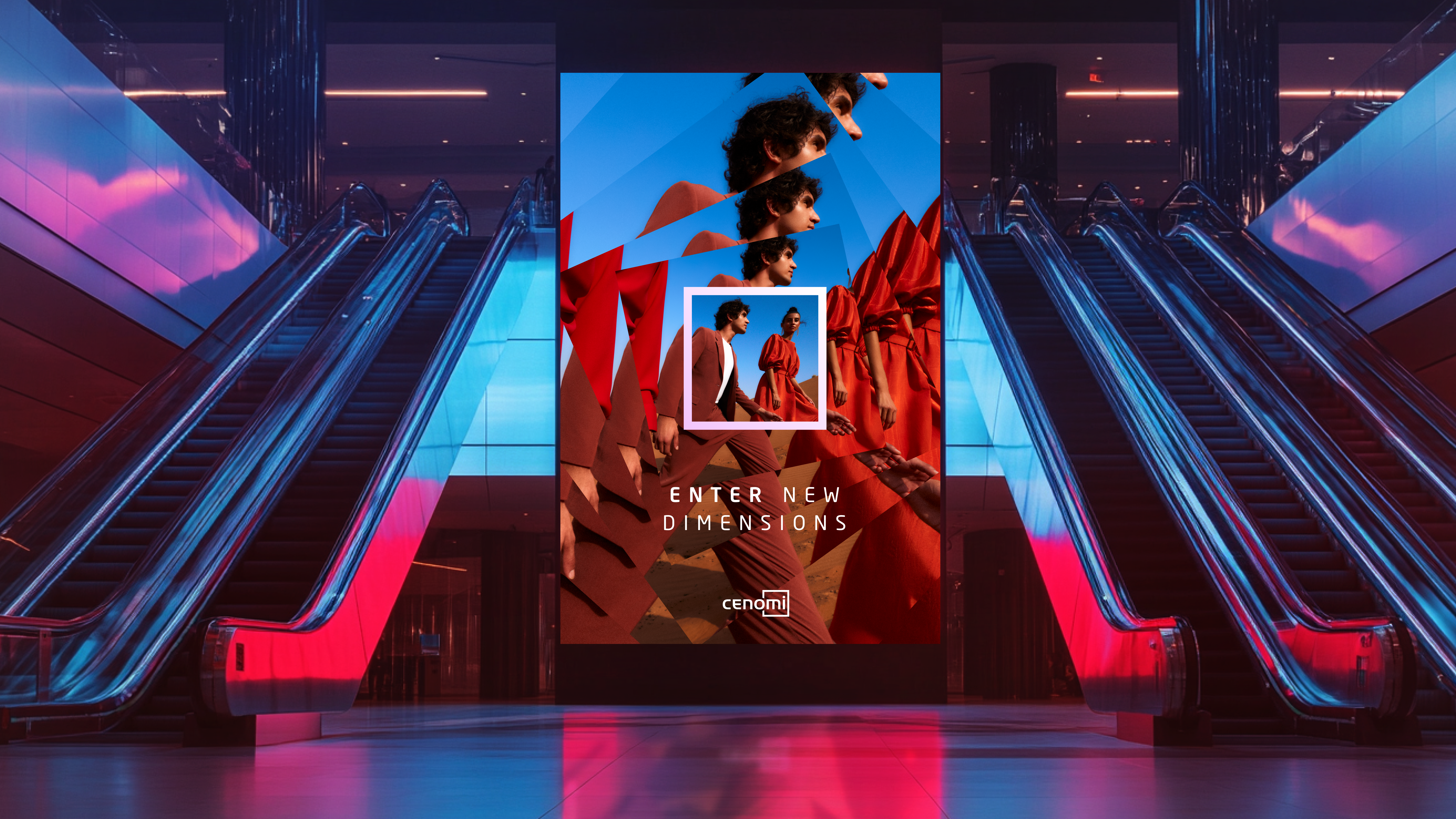 A photo of a digital display ad for Cenomi, featuring a couple in a desert with the copy "Enter new dimensions." Escalators flank both sides of the display, which appears to be in a mall.