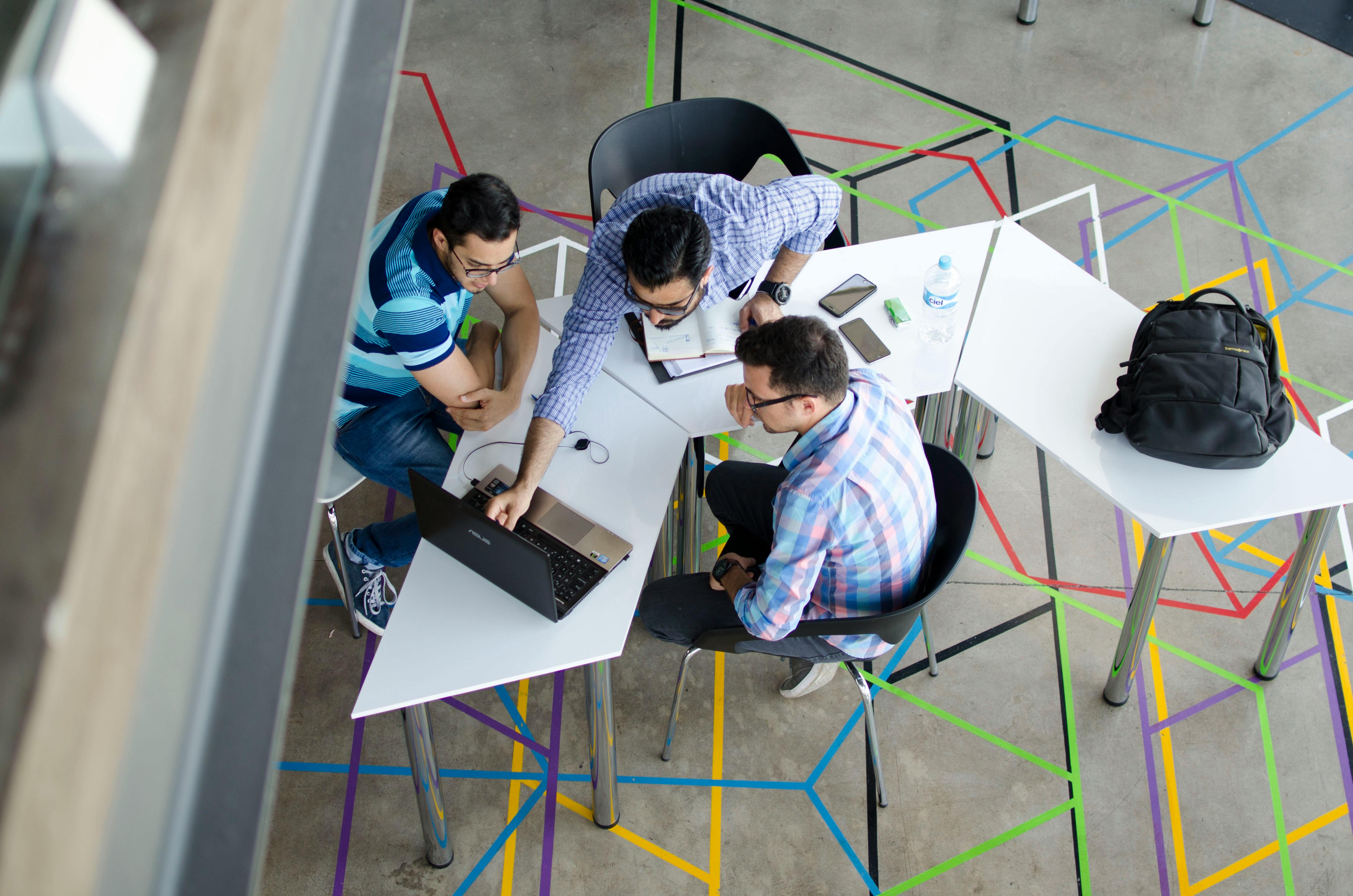Data team members working together at a desk