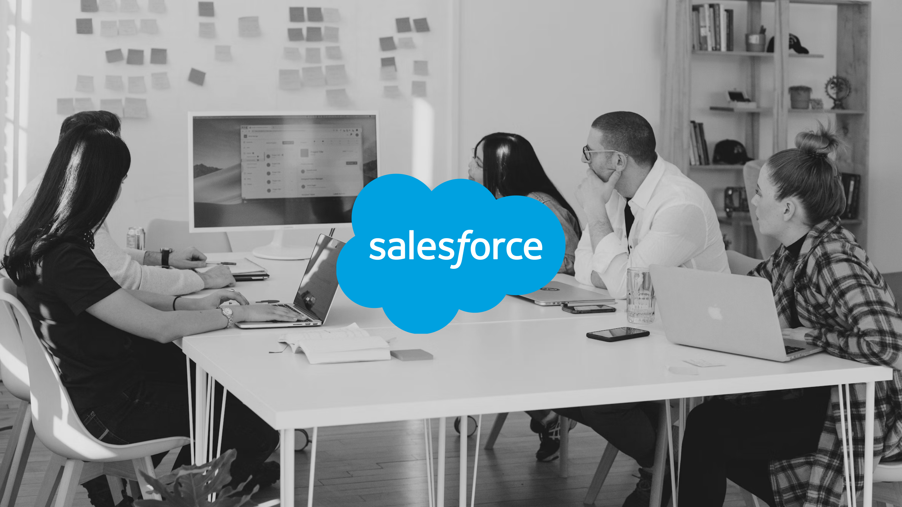 Employees working together around a desk