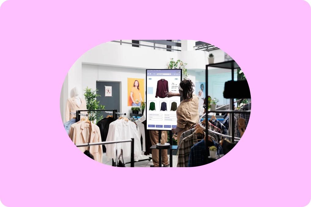 A person shopping in a store on a large screen reviewing items for purchasing