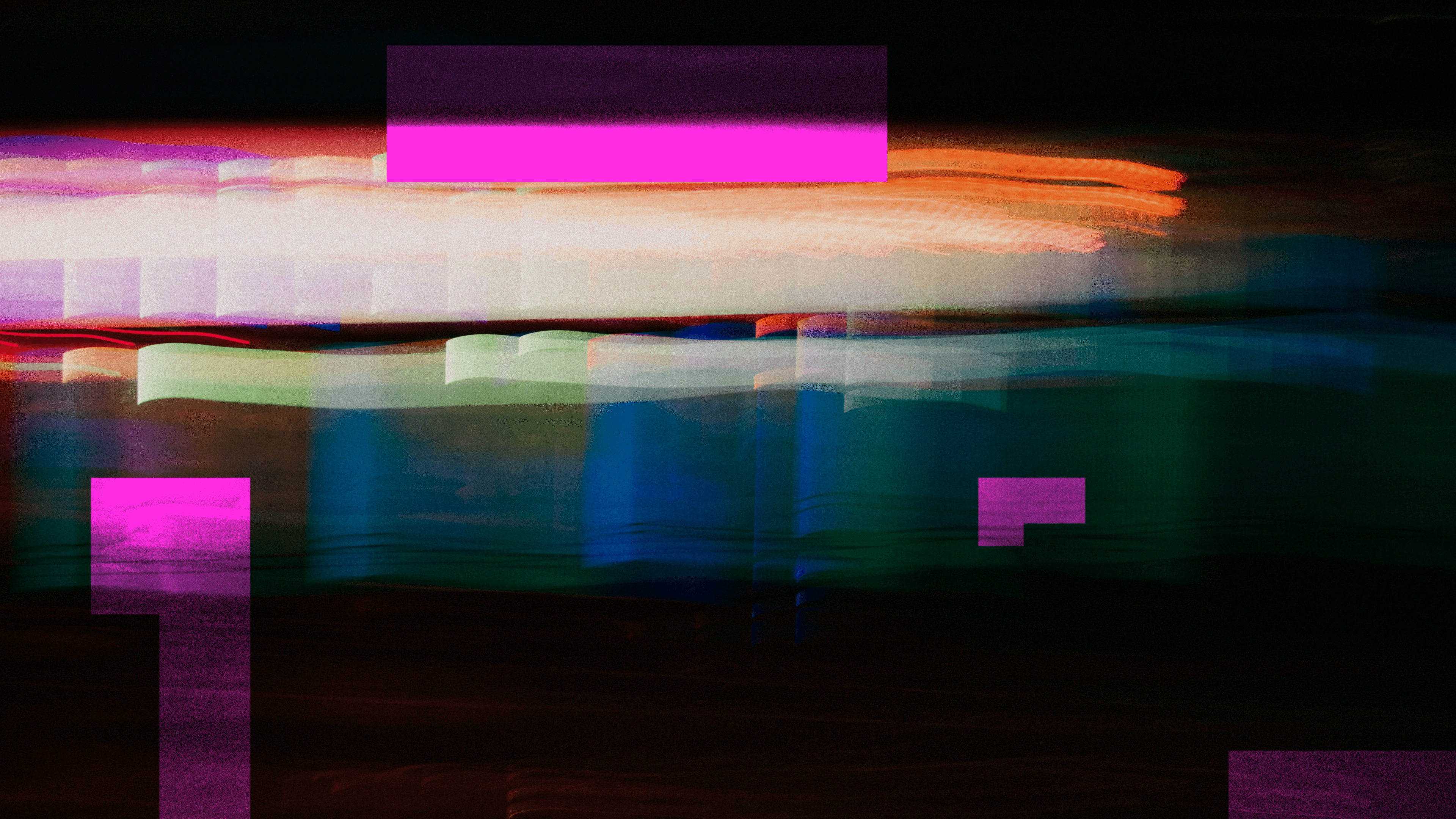 A light trail of different pinks, oranges, and light yellow shows something is speeding past a sign outside