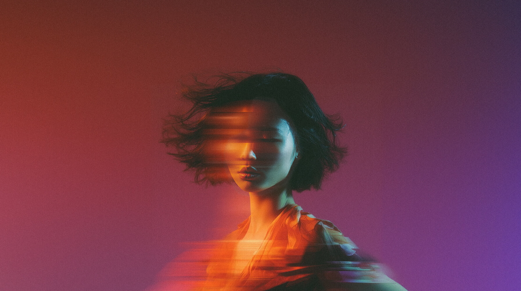 woman with digital effect that makes it look like a long exposure photo where she is moving horizontally
