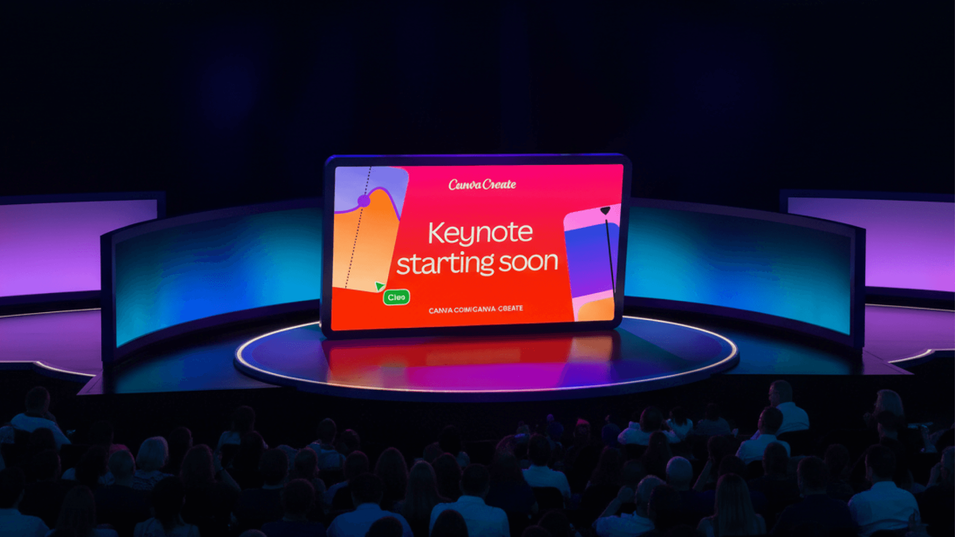 A wide shot of a tech conference stage featuring a large, tablet-shaped central screen that reads "Canva Create" and "Keynote starting soon." The screen is bright red, flanked by curved, glowing blue side panels. In the foreground, a large audience is seated in a darkened theater setting, facing the stage.