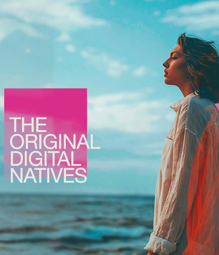 A woman standing in front of the ocean and the text "The Original Digital Natives"