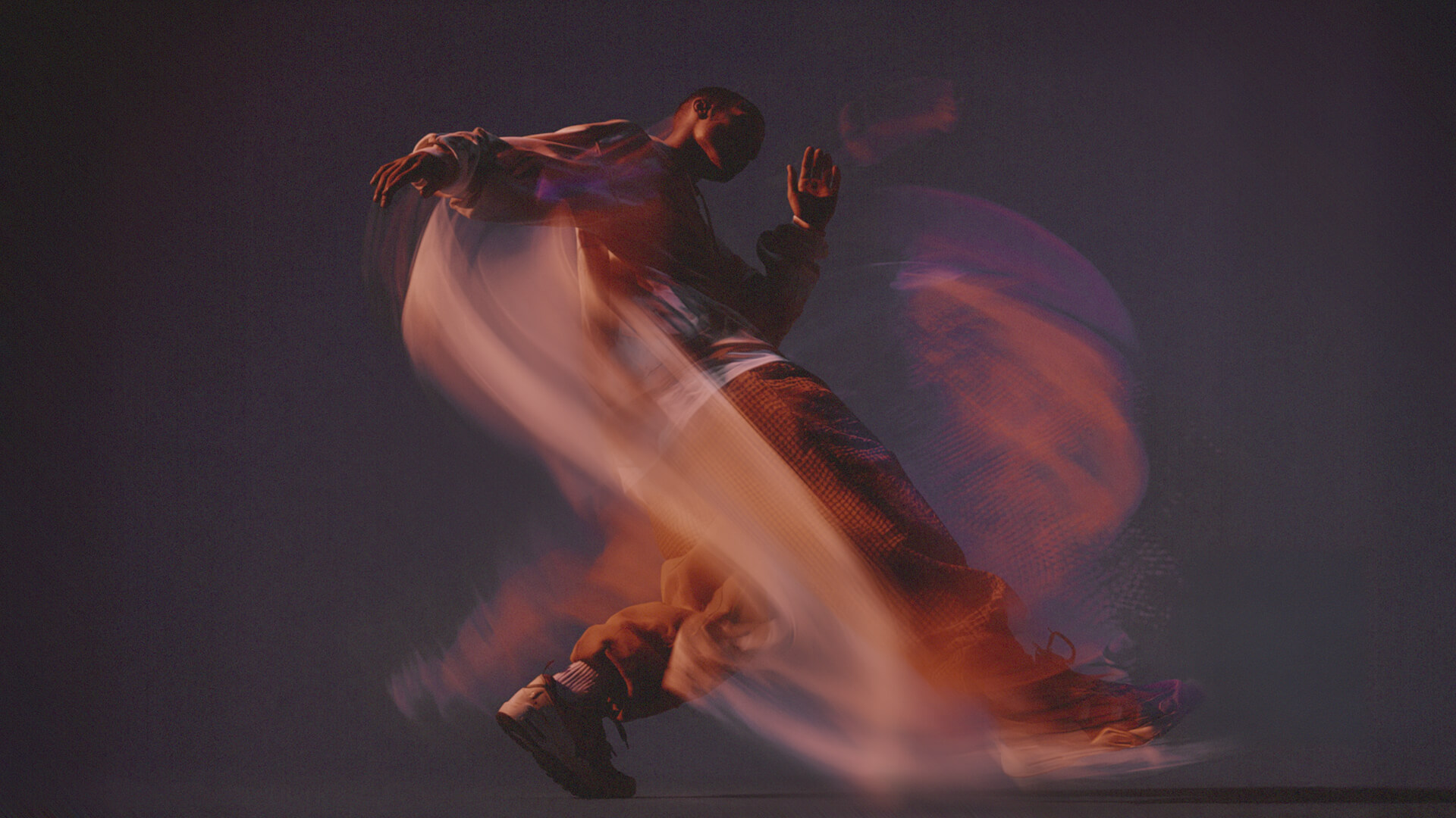 man dancing with swirls around