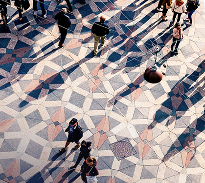 aerial view of people walking in a city square