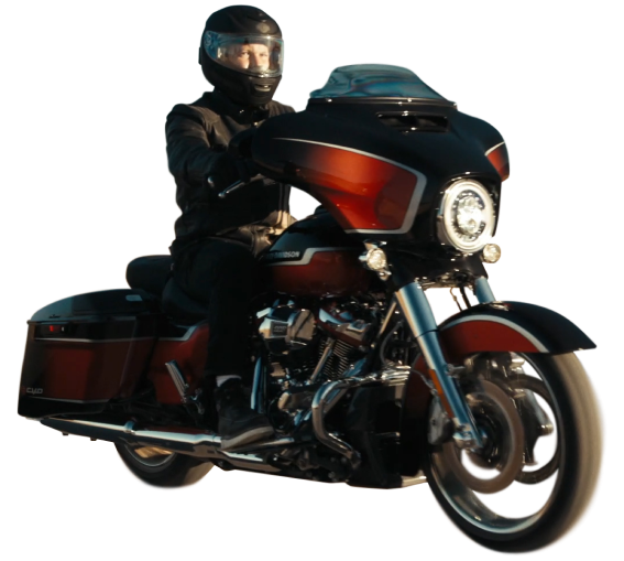 A person riding a Harley Davidson motorcycle