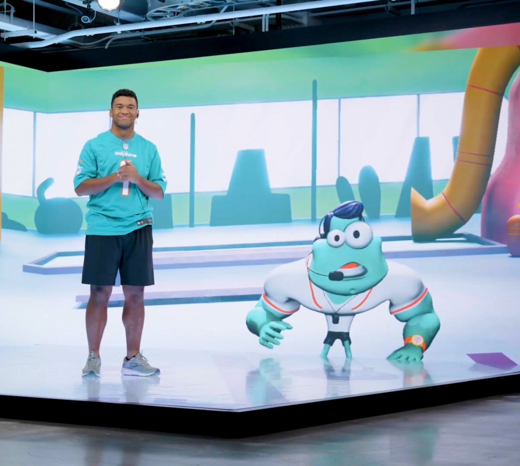 Tua Tagovailoa and Terry on a production stage filming