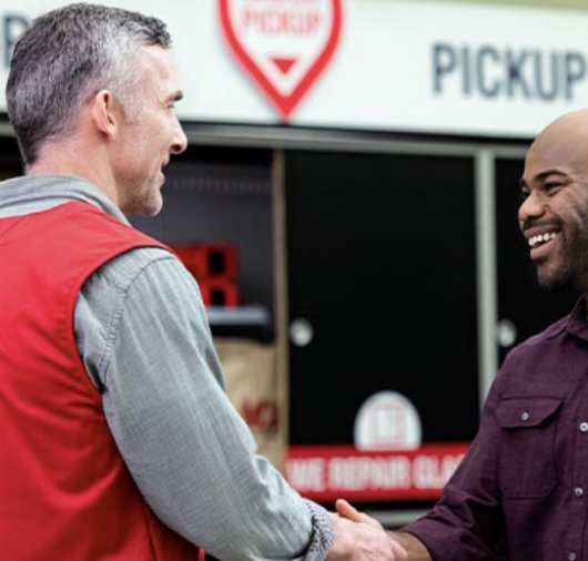 Ace Hardware employee with customer
