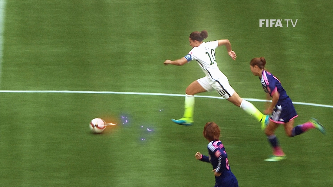 Three players chasing a soccer ball