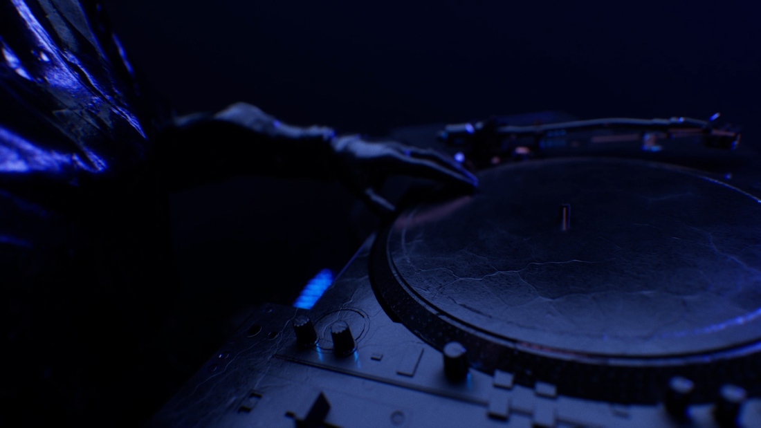 Hands spin records on a turn table