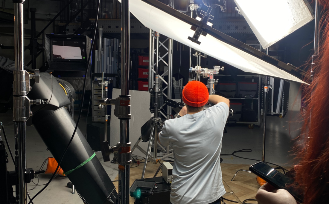 film studio with lights and camera equipment