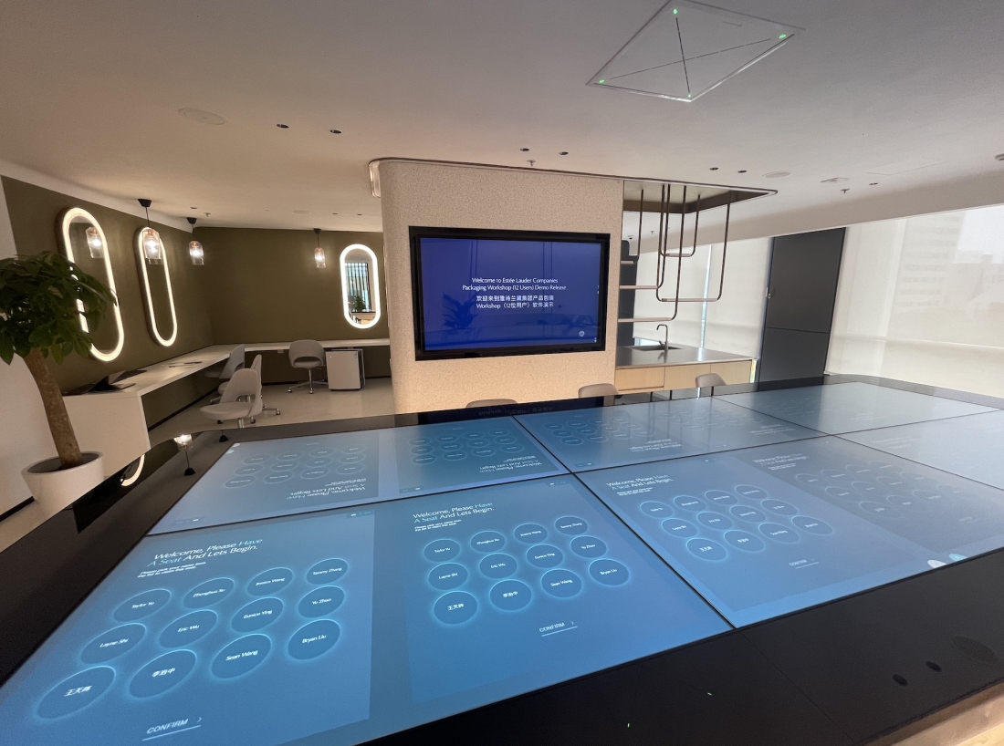Inside the Estee Lauder companies experience showing a digital floor with screens