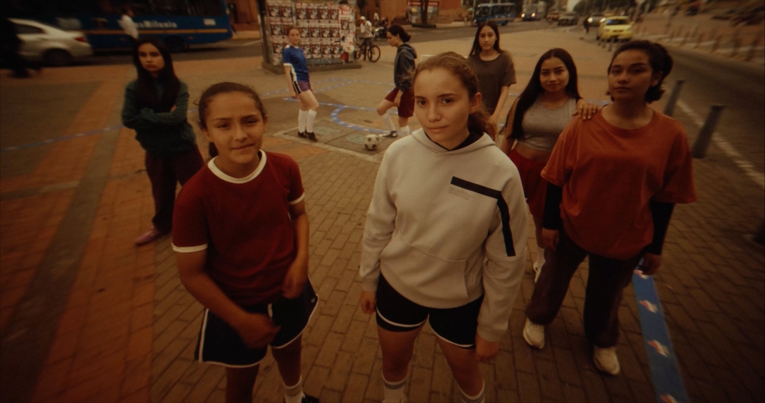 A group of girls playing basketball