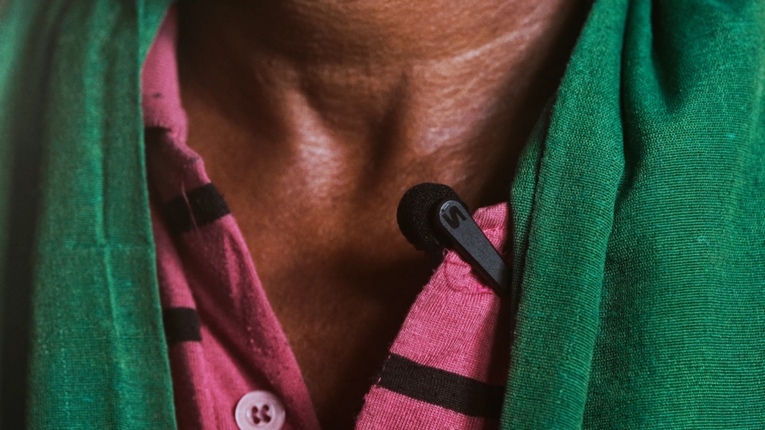 Closeup of a small; microphone attached to a shirt