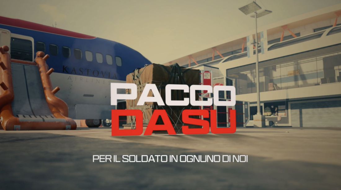 In the background you see an airport setting with the back of the plain. In front of it a package with the copy 'Pacco Da Su' on top of the image.