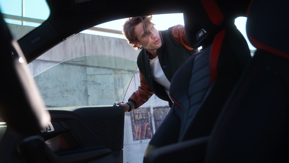 A person opening a bmw car door