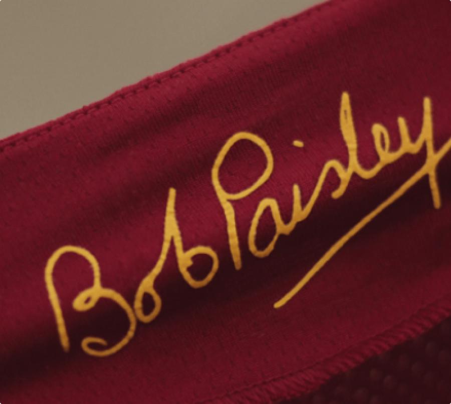 Inside fabric of a shirt with the signature "Bob Paisley"