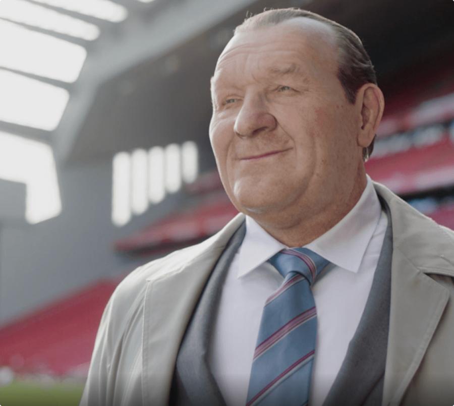 Portrait of Bob Paisley, created by 3D modeling, on the field at a stadium