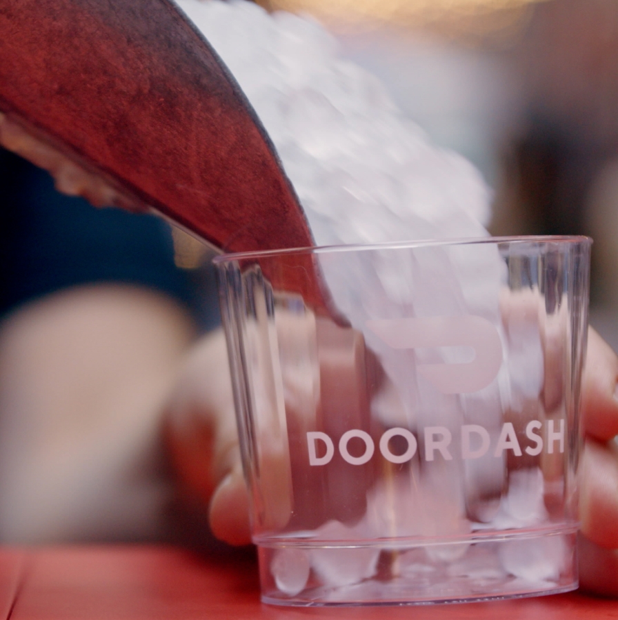 Ice being poured into a DoorDash glass
