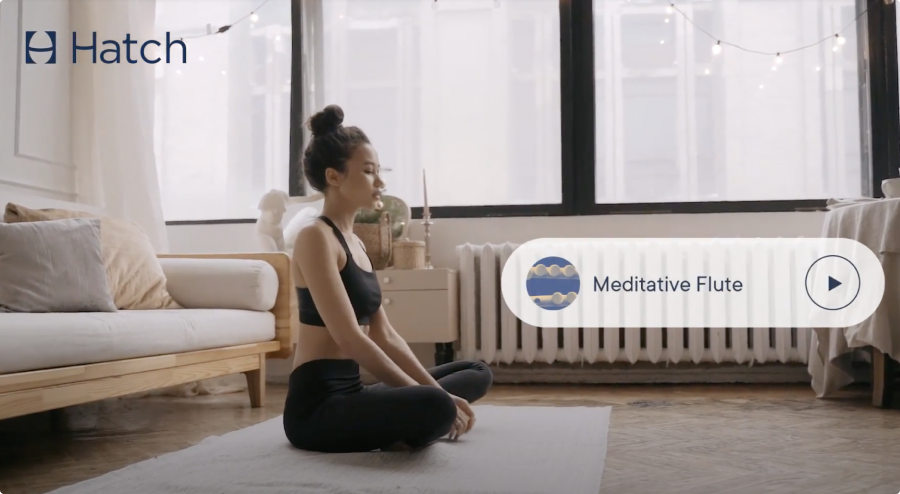 A woman meditating on her floor