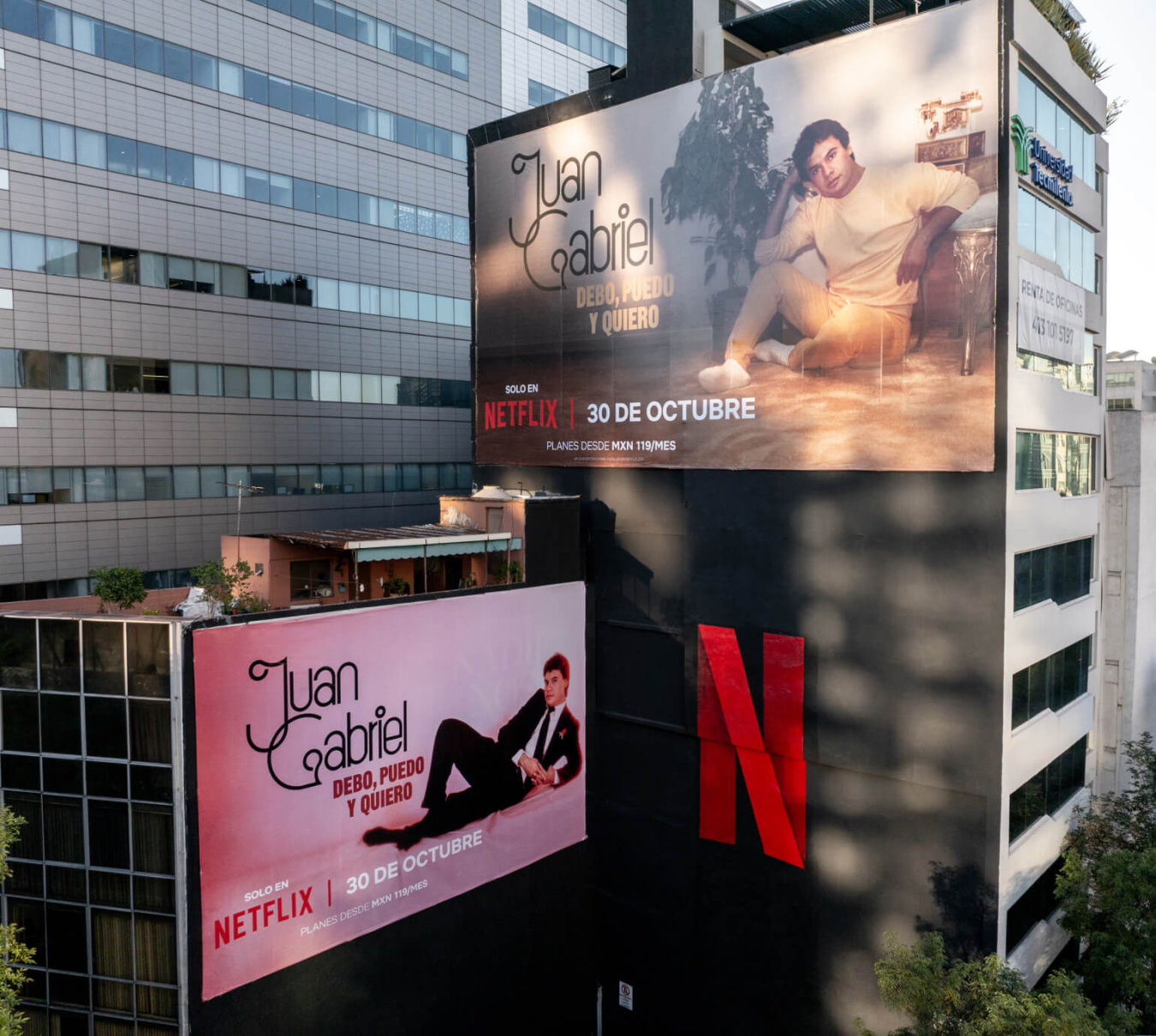 Two large buildings with the Netflix advertising on them featuring the documentary about Juan Gabriel.upcoming release 