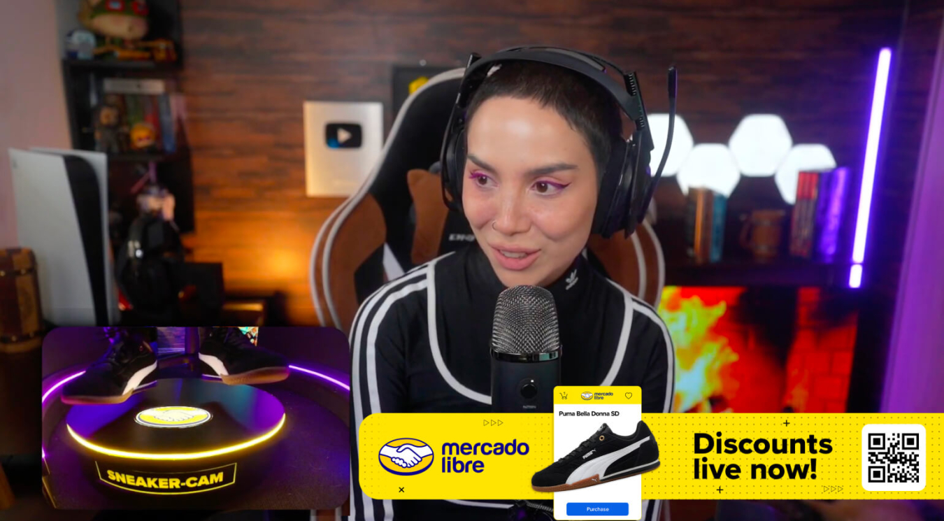 A female live streamer with the Sneaker Cam activated and a banner that allows users to scan and buy those shoes.